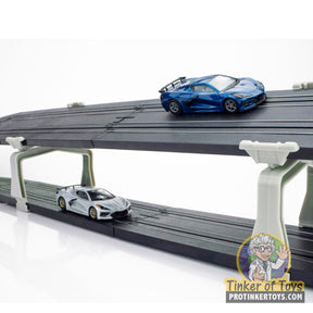Toy cars on a multi-level black track support structure for AFX/Racemasters 70616