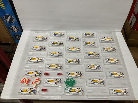 Assortment of small, yellow and blue Honda F1 race car toys in blister packs for Tyco B9099 SHEET