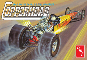 Yellow and orange rear-engine dragster model kit on a track for AMT AMT1282