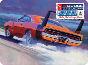 Orange 1969 Dodge Charger Daytona model kit speeding on a track for AMT AMT1232