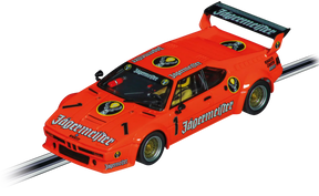 Orange BMW M1 race car model with Jägermeister livery on a track for Carrera Evolution 20027792