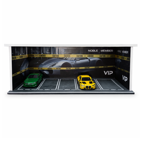 Diecast cars in a garage diorama with caution tape backdrop for Shou Cang Jia IMX2562