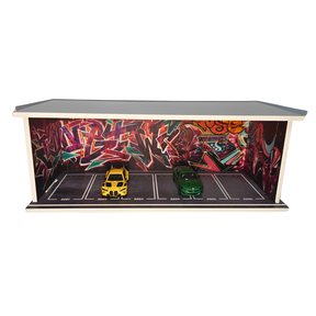 Diorama scene with yellow and green diecast cars in a graffiti-covered setting for Shou Cang Jia IMX2561
