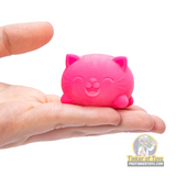 Pink cat-shaped putty held in an open hand for Schylling CCTND