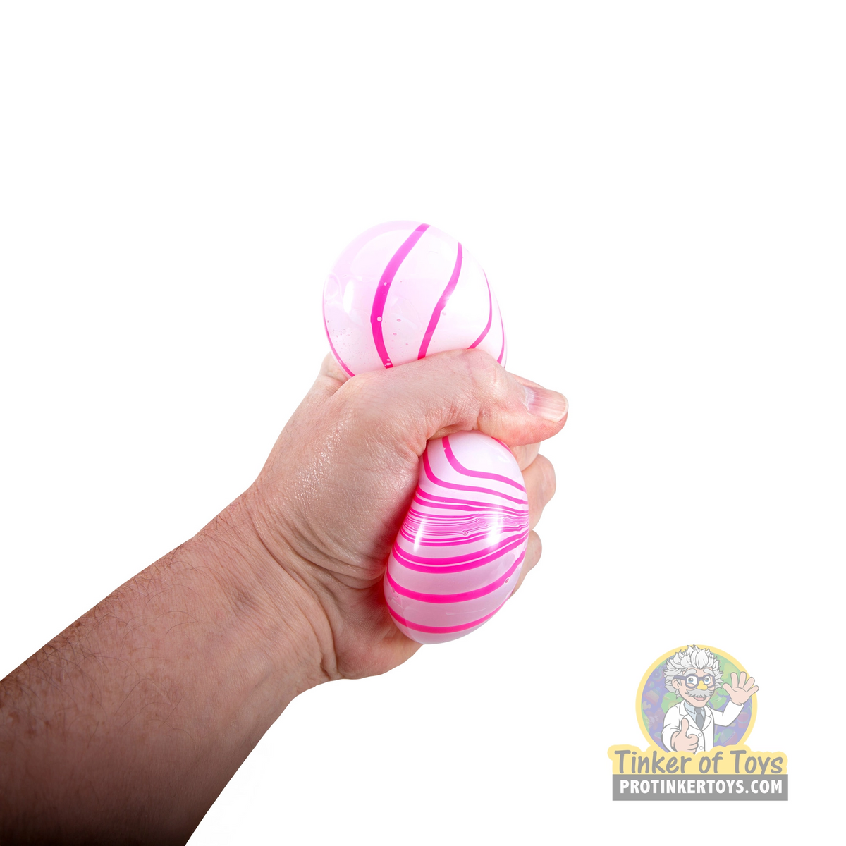 Hand holding colorful, striped candy swirl toy for Schylling CSNCBND