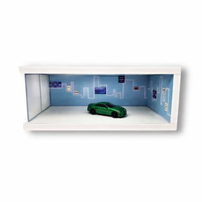 Green diecast car in a blue, light-up parking display scene for Shou Cang Jia IMX2571