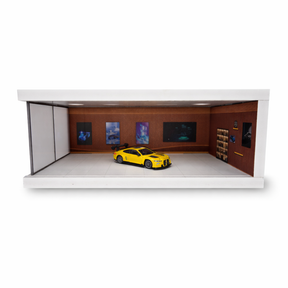 Yellow diecast car displayed in a detailed, lit parking garage scene for Shou Cang Jia IMX2570