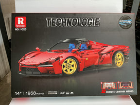 Red RC model car box art showing a 1958 Ferrari Daytona SP3 build kit for Reobrix REO11025