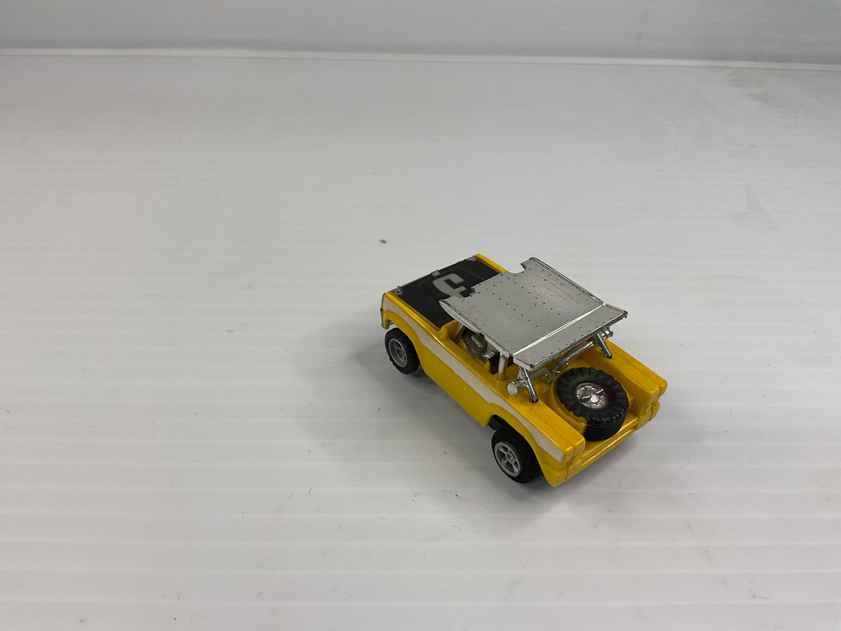 Aurora AFX non-magnatraction Ford Baja Bronco Yellow/Black/White #3 | 1769 | Aurora - AFX