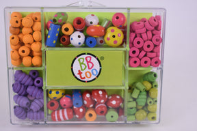 Assortment of colorful beads in a clear storage case for BBTOO 951
