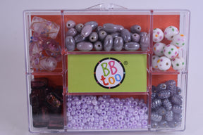 Assortment of beads in a clear plastic storage box for BBTOO 935