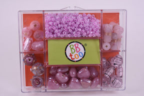 Assortment of purple and pink beads in a clear storage case for BBTOO 791