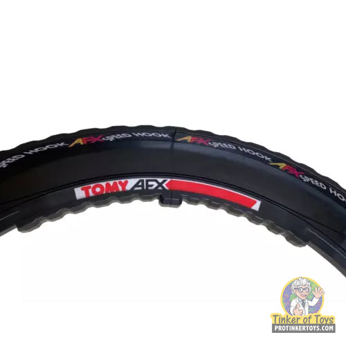 Curved drift action set tire with "Tomy AFX" branding for Aurora Tomy AFX Vintage 8994