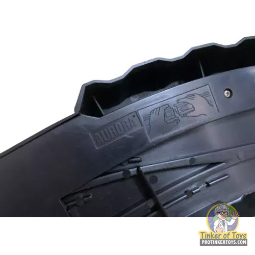 Black plastic component with "Aurora" logo and hand graphic for Aurora Tomy AFX Vintage 8994