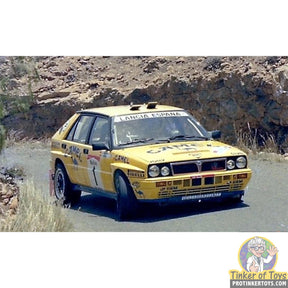 Yellow Lancia rally car model on dirt road for SCX Advance E10521X300