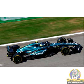 Black and teal F1 race car replica, resembling an Aston Martin for SCX Advance E10527X300