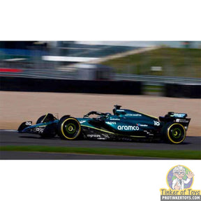 Black and green F1 race car replica on track for SCX Advance E10528X300
