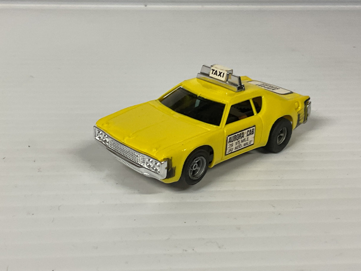 Aurora AFX non-magnatraction Matador Taxi Yellow w/scuff mark  | 1938 | Aurora - AFX