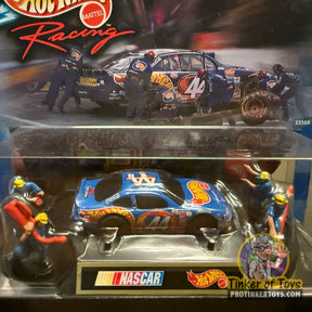 NASCAR slot cars: blue #44 Pontiac, crew figures, and packaging for Tyco 33569-9993