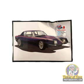 Purple 1963 Studebaker Avanti model car on a display card for AMT AMT1312