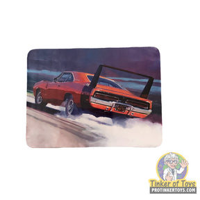 Red 1969 Dodge Charger Daytona model kit on a track for AMT AMT1232
