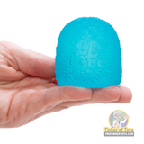 Blue, textured, egg-shaped toy held in a hand for Schylling GDND