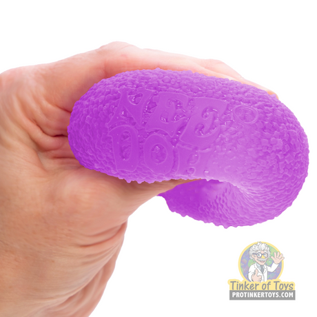 Purple, textured fidget toy held in a hand for Schylling GDND