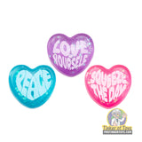 Three heart-shaped squishies: "Peace," "Love Yourself," and "Squeeze The Day." for Schylling GVND