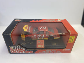 Red and yellow die-cast race car model in its original box for Racing Champions 00124