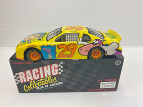 Yellow race car model with number 29, displayed in a collectible box for Racing Champions