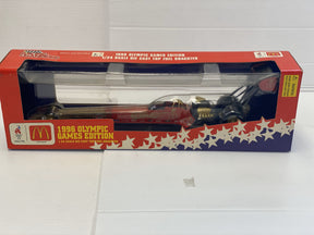 Red and black 1/24 scale die-cast dragster in its box for Racing Champions 09712