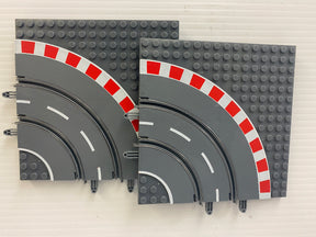 Curved track pieces for micro slot racing, featuring red and white curbing for Jupiter Creations G9002