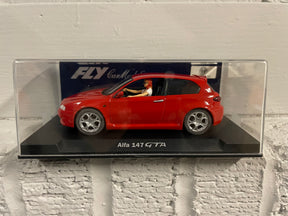 Red slot car, Alfa 147 GTA, displayed in a clear case for Fly Car 88093