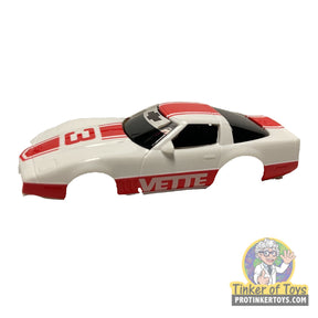 White toy Corvette with red accents and "VETTE" lettering for Tyco B8912, rear view