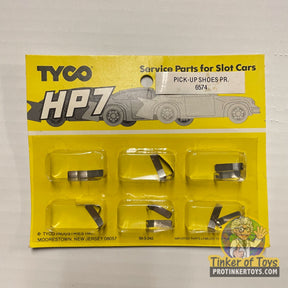 Assortment of small, black replacement shoes for Tyco HP7 slot cars for 6574