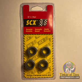 Set of four black wheels for RC cars, packaged in clear plastic for SCX 87710