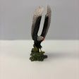 Sculpture of a bald eagle perched on green base for Mamejo MAJ52014
