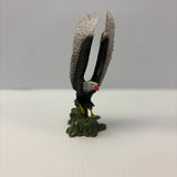 Sculpture of a bald eagle perched on green base for Mamejo MAJ52014
