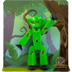 Green goblin minifigure toy standing in a jungle setting for StikBot TST626
