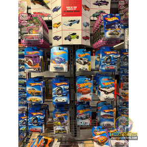 Assorted Hot Wheels die-cast cars displayed on shelves for UPD 4406