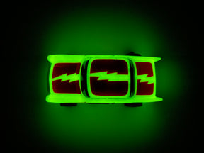 Glowing toy car with blue lightning stripes on a dark background for Tyco B15012
