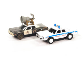 Two slot cars: a Bluesmobile and a Chicago police car for Auto World SRS359SC