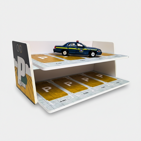 Two-story diorama of a parking lot with a blue police car for Shou Cang Jia IMX2580