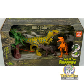 Dinosaur figure set with T-Rex, raptor, and foliage on a display base for King Me World IMX17247