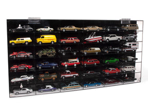 Acrylic display case filled with various slot cars for Auto World AWDC027