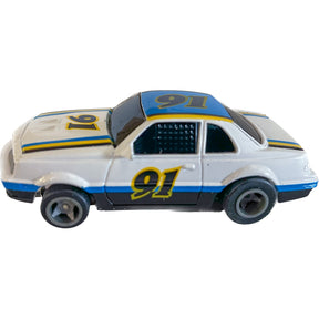 White, blue, and yellow NASCAR race car toy with lights for Life-Like 13016B
