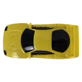 Yellow toy car, top-down view, representing a 1991 Ferrari F40 for Tyco B6243