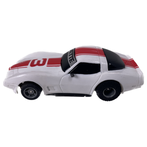 White toy Corvette with red and black accents, featuring a "W" decal for Tyco B15007
