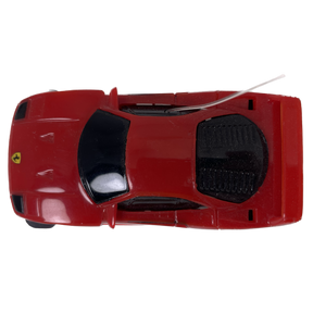 Red toy car, viewed from above, showing the underside details for Tyco B6331