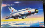 Blue sky scene with a silver Mig-21 reconnaissance jet in flight for MasterCraft